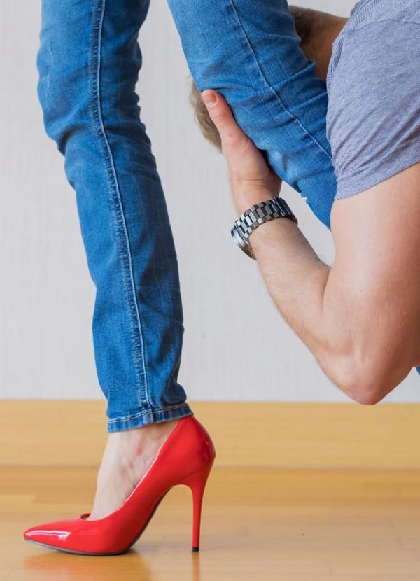 Man holding onto woman